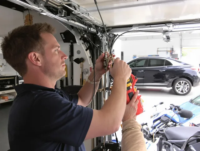 Westwood Garage Door Repair safety certified technician performing cable replacement in Westwood