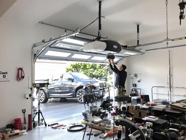 Westwood Garage Door Repair specialist installing smart garage door opener system in Westwood home
