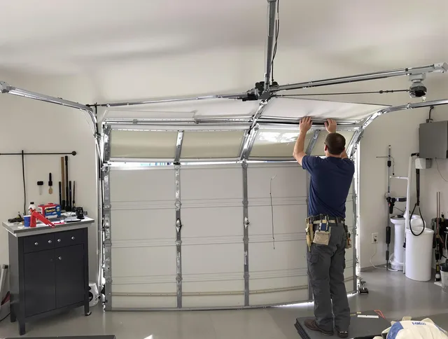 Westwood Garage Door Repair specialist performing precise section replacement on Westwood garage door