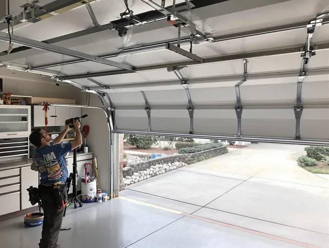 Garage door track repair service by Westwood Garage Door Repair in Westwood